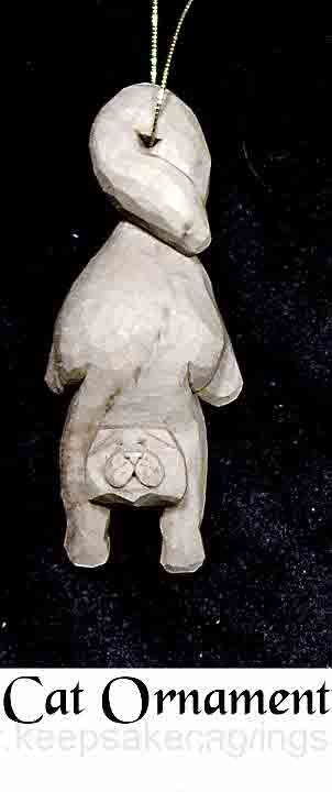 cat ornament hanging from tail